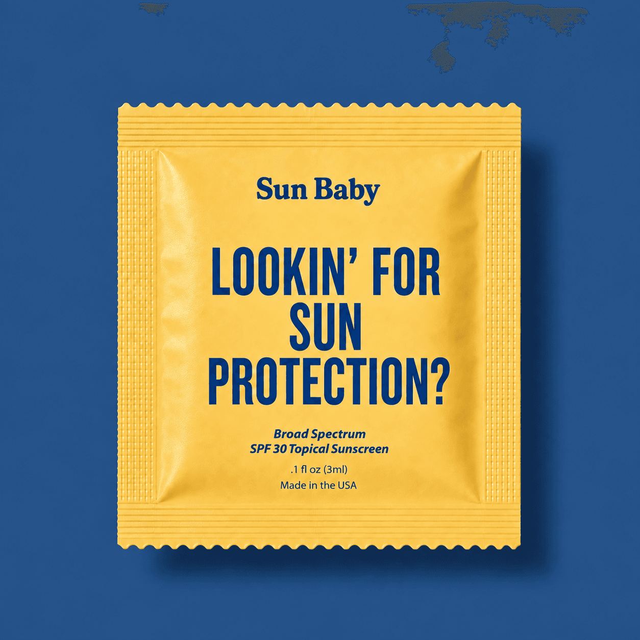 Sun Baby SPF 30 single-use packet, flat lay